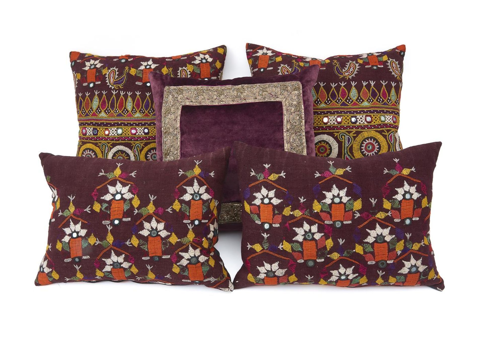 A GROUP OF FIVE CUSHIONS INCLUDING TWO PAIRS AND A SINGLE BY GUINEVERE