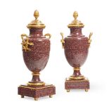 A PAIR OF ORMOLU MOUNTED RED PORPHYRY URNS FRENCH, LATE 19TH CENTURY