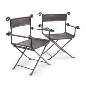 A PAIR OF SPANISH WROUGHT IRON AND LEATHER FOLDING CHAIRS, MID 20TH CENTURY