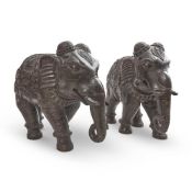 A PAIR OF HIGHLY CARVED WOOD CAPARISONED ELEPHANTS, 19TH CENTURY