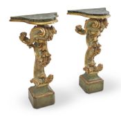 A PAIR OF ITALIAN BAROQUE PAINTED AND PARCEL GILT PEDESTAL CONSOLE TABLES, LATE 18TH CENTURY