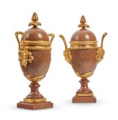 A PAIR OF ORMOLU MOUNTED ROSE GRANITE URNS CIRCA 1880, FRENCH