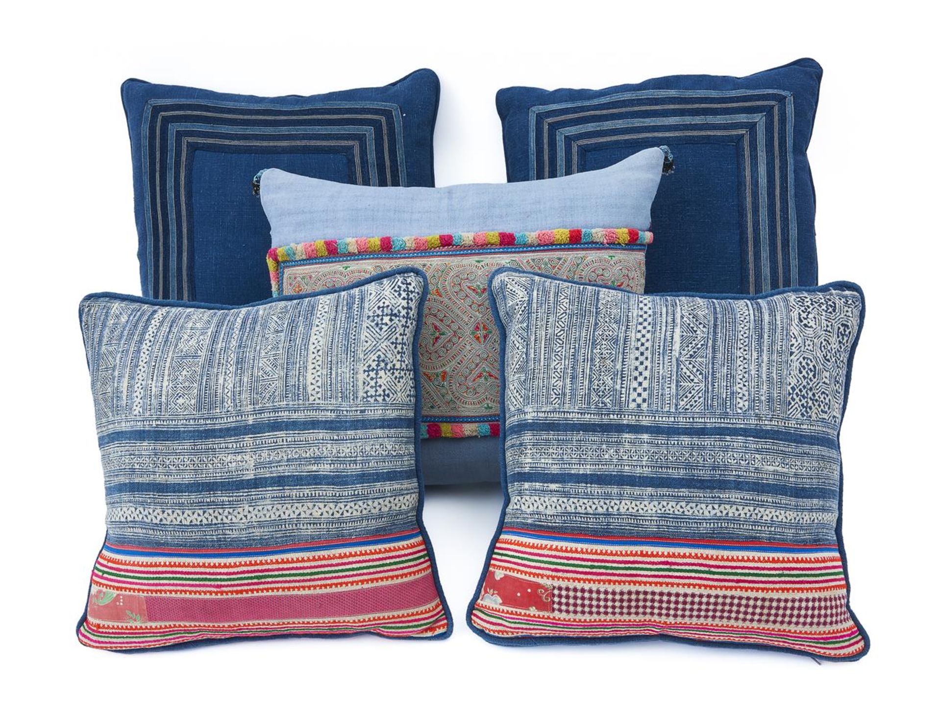 A GROUP OF FIVE CUSHIONS INCLUDING TWO PAIRS AND A SINGLE BY GUINEVERE