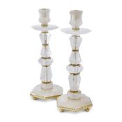 A PAIR OF ROCK CRYSTAL AND GILT METAL MOUNTED FACETTED CANDLESTICKS BY GUINEVERE