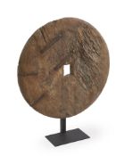 A CARVED WOODEN WHEEL ON STAND, PHILIPPINES, 18TH/ 19TH CENTURY