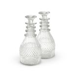 A PAIR OF CUT GLASS RING NECK DECANTERS AND STOPPERS, FIRST QUARTER 19TH CENTURY