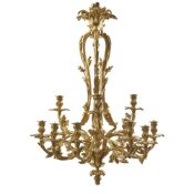 AN ORNATE LOUIS XV STYLE ORMOLU ROCOCO TWELVE LIGHT CHANDELIER FRENCH, CIRCA 1900