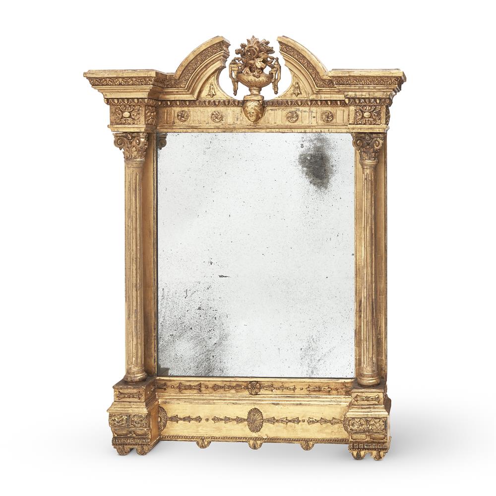 A GEORGE IV CARVED GILTWOOD WALL MIRROR, PROBABLY IRISH, CIRCA 1830