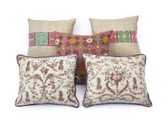 A GROUP OF FIVE CUSHIONS INCLUDING TWO PAIRS AND A SINGLE BY GUINEVERE