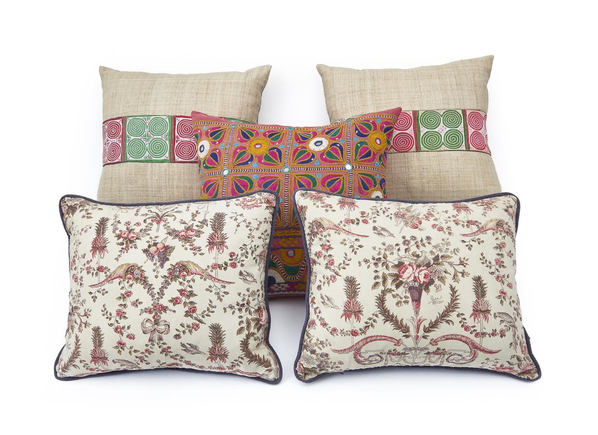 A GROUP OF FIVE CUSHIONS INCLUDING TWO PAIRS AND A SINGLE BY GUINEVERE