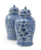 A PAIR OF CHINESE BLUE AND WHITE TEMPLE JARS AND COVERS ,LATE 19TH CENTURY