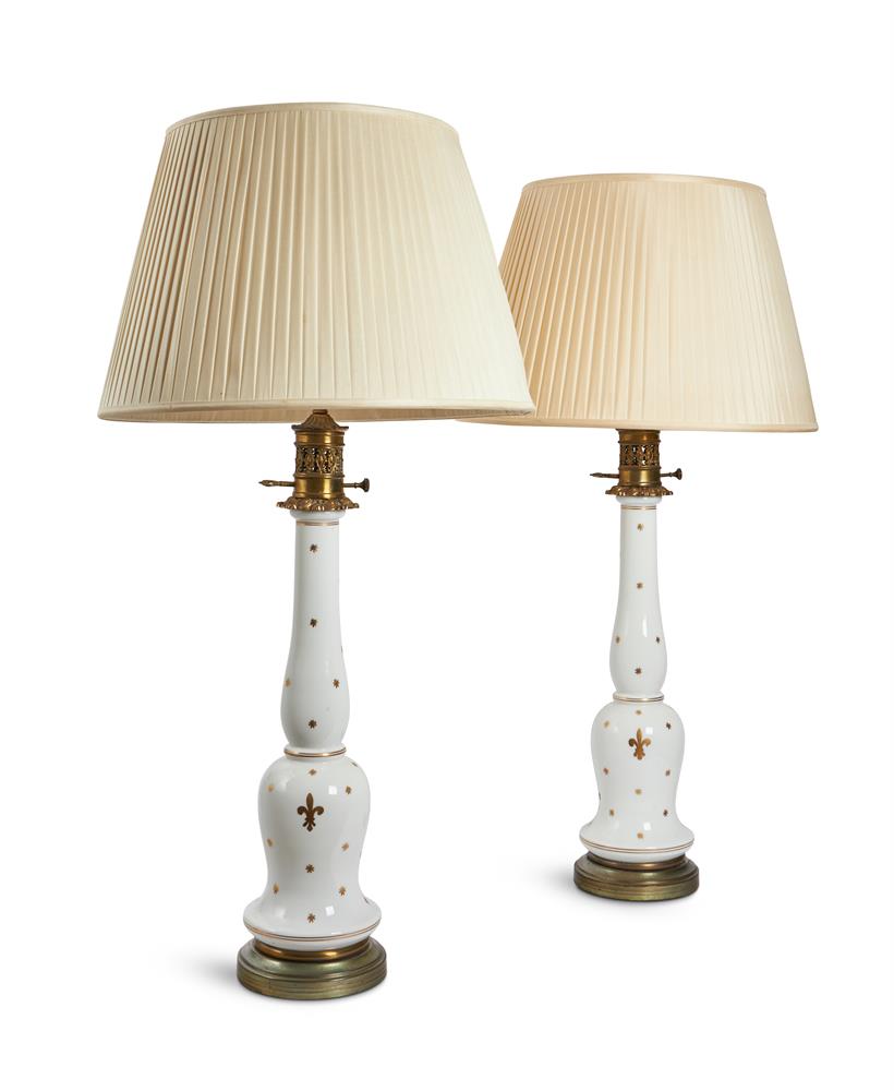 A PAIR OF FRENCH OPAQUE WHITE AND GILT METAL MOUNTED PARAFFIN LAMP BASES, MODERN