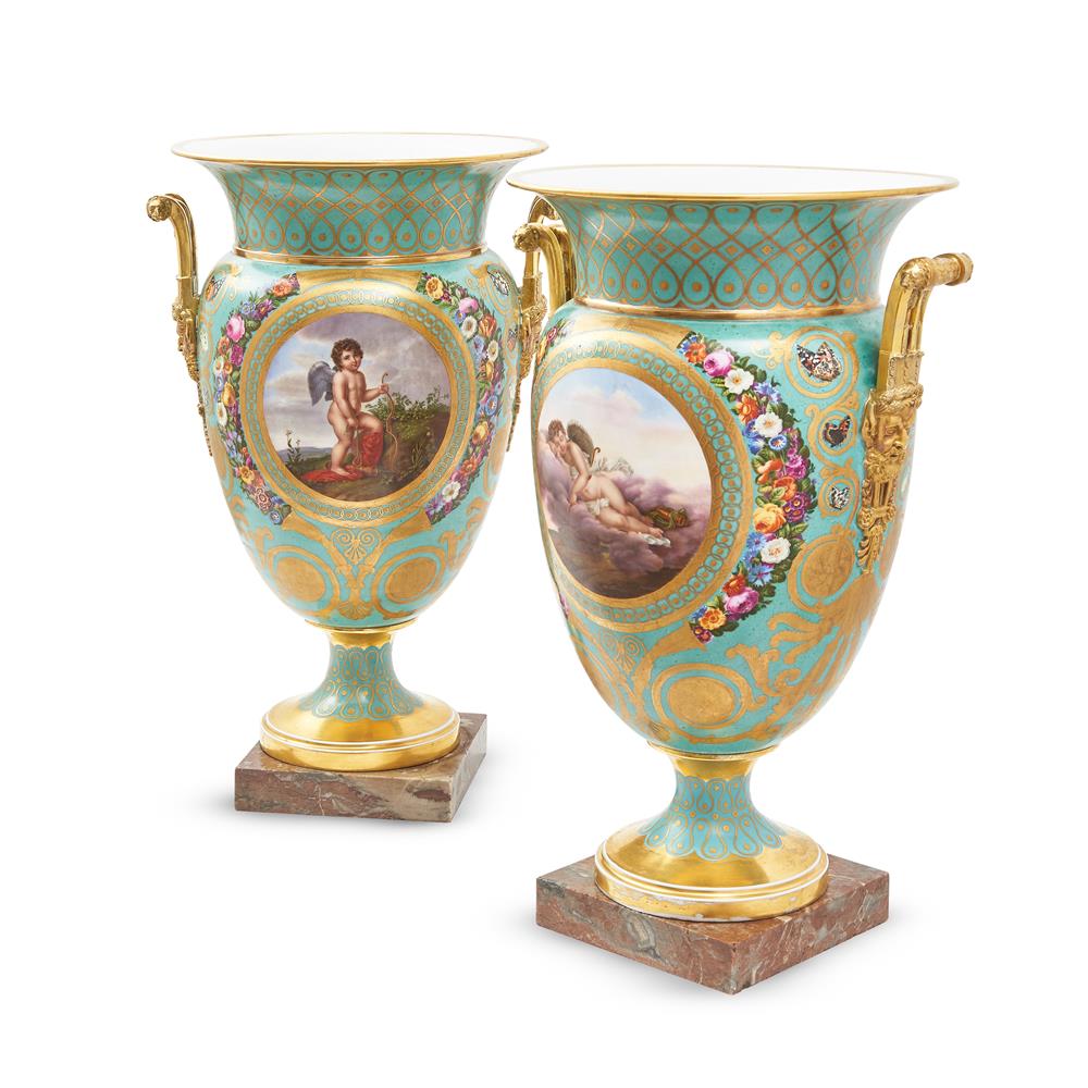 A PAIR OF FRENCH PORCELAIN GILT AND PALE-BLUE GROUND TWO-HANDLED URNS, 19TH CENTURY