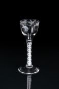 AN ENAMELLED OPAQUE-TWIST WINE GLASS OF BEILBY FAMILY TYPE