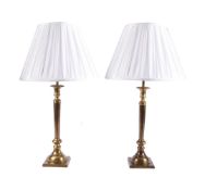 A PAIR OF PATINATED BRASS TABLE LAMPS