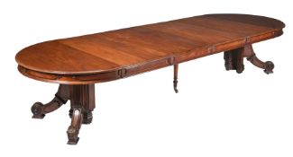 A VICTORIAN WALNUT EXTENDING DINING TABLE