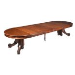 A VICTORIAN WALNUT EXTENDING DINING TABLE