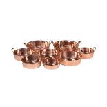 A HARLEQUIN SET OF EIGHT GRADUATED COPPER JAM PANS