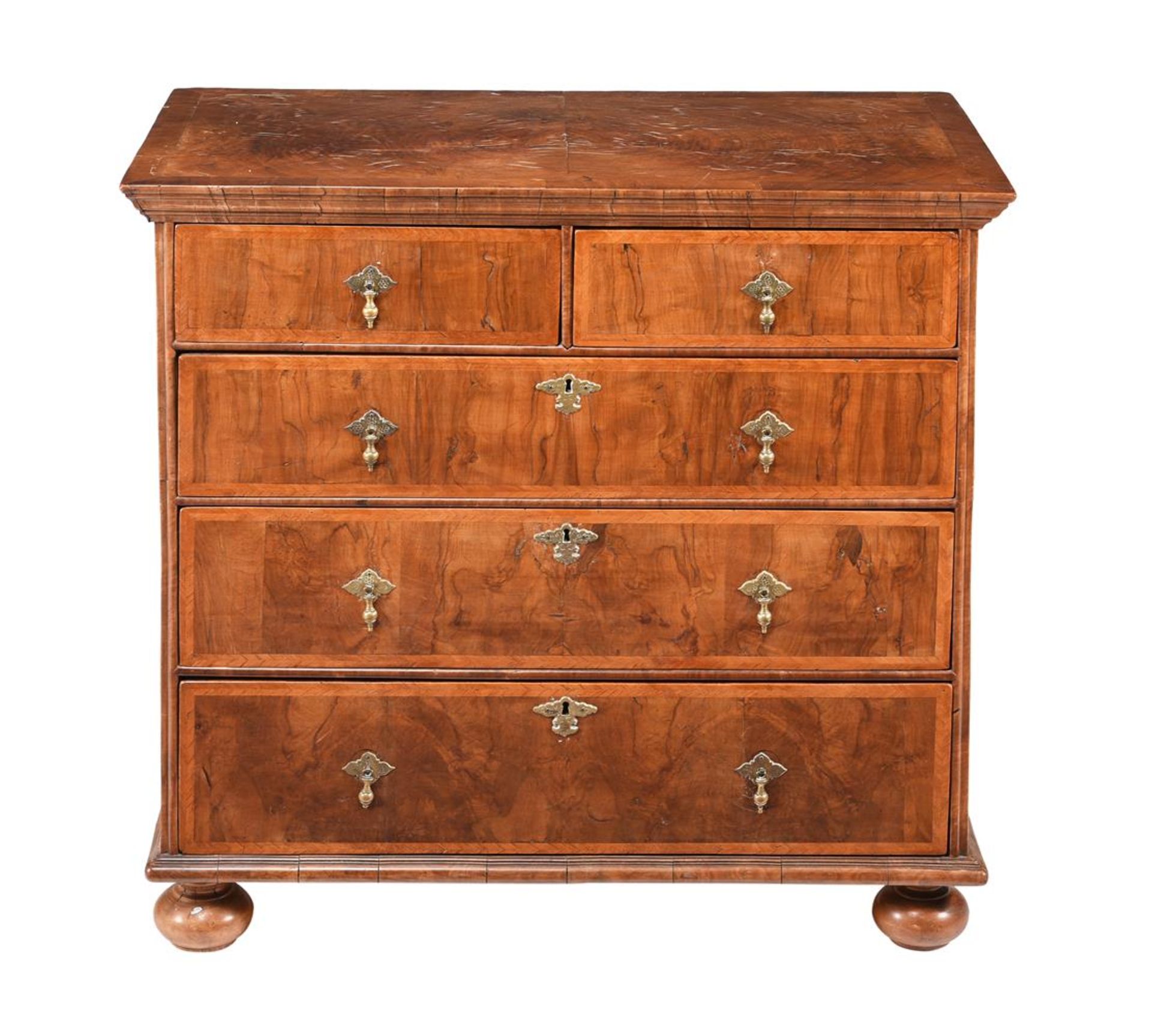 A WALNUT AND FEATHER BANDED CHEST OF DRAWERS