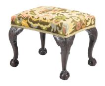 A CARVED MAHOGANY AND UPHOLSTERED NEEDLEWORK STOOL IN GEORGE III STYLE