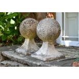 A PAIR OF COMPOSITION STONE PIER FINIALS IN EDWARDIAN TASTE