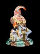 A STAFFORDSHIRE MODEL OF MR. PUNCH AND HIS DOG TOBY