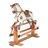 A DAPPLED GREY ROCKING HORSE