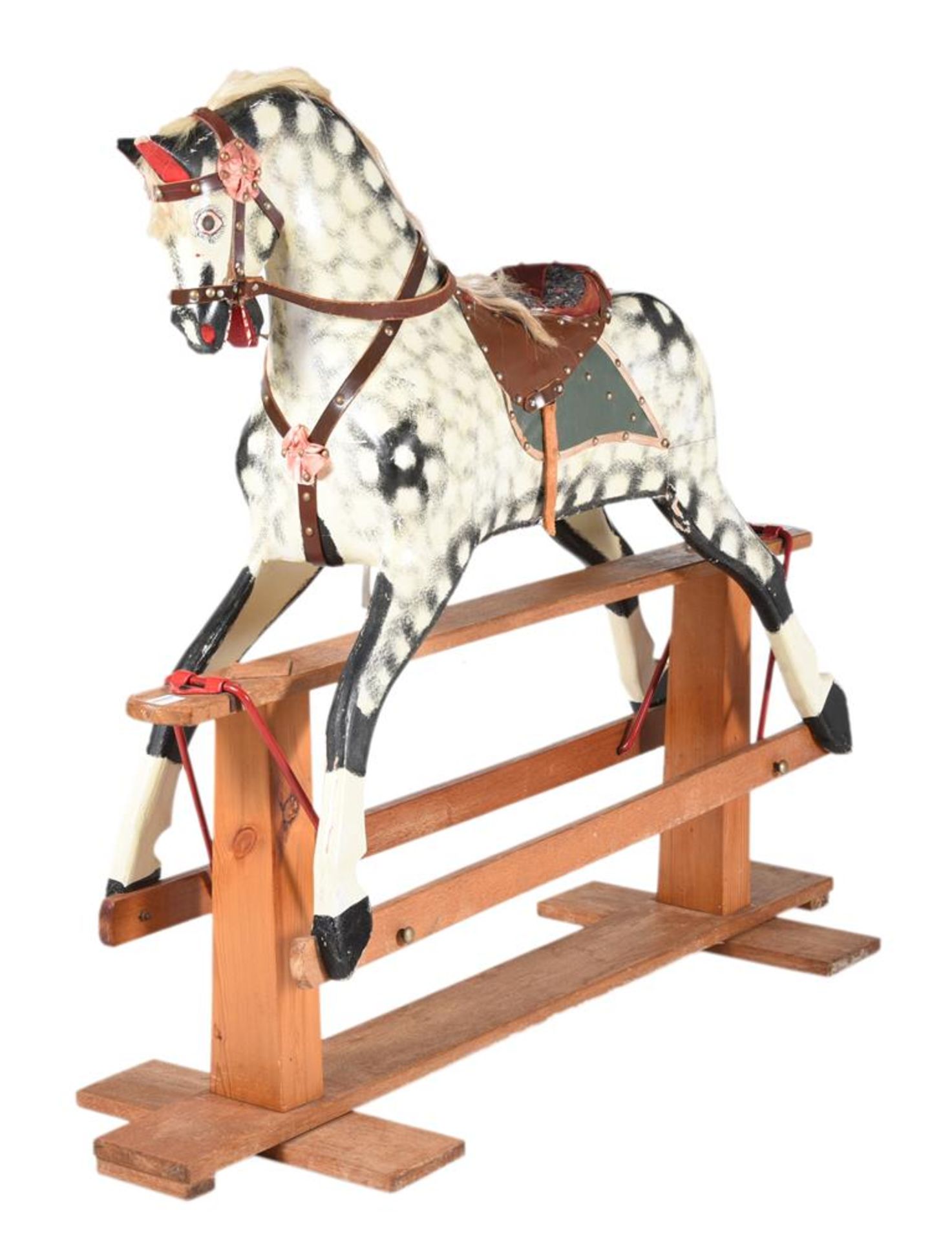 A DAPPLED GREY ROCKING HORSE