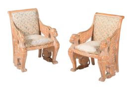 A PAIR OF LIMED BEECH AND PARCEL GILT ARMCHAIRS IN EMPIRE TASTE