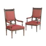 A PAIR OF NORTH ITALIAN CARVED WALNUT AND UPHOLSTERED ARMCHAIRS