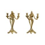 A PAIR OF GILT METAL THREE LIGHT CANDELABRA