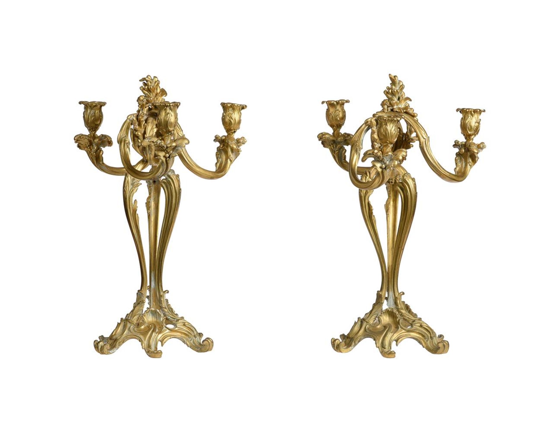 A PAIR OF GILT METAL THREE LIGHT CANDELABRA