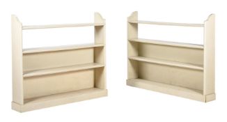 A PAIR OF CREAM PAINTED OPEN BOOKSHELVES