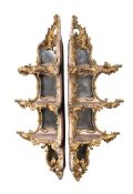 A PAIR OF GILTWOOD AND COMPOSITION CORNER WALL SHELVES IN ROCOCO STYLE