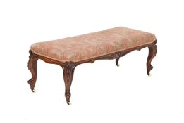 A VICTORIAN WALNUT AND UPHOLSTERED CENTRE STOOL