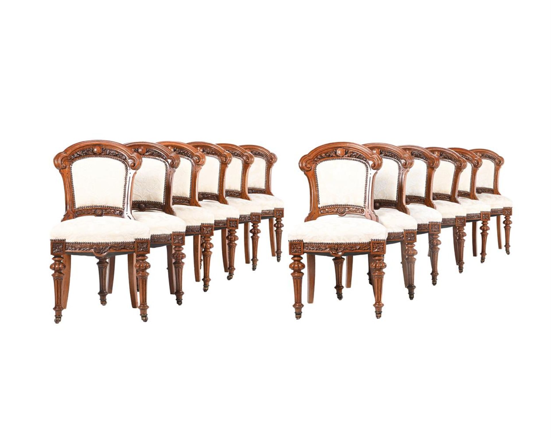 A SET OF TWELVE VICTORIAN STAINED OAK SIDE CHAIRS