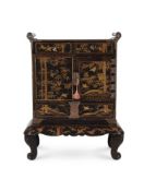 A CHINESE EXPORT BLACK LACQUER AND GILT CABINET ON STAND