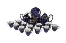 A SEVRES BLUE GROUND AND GILT PART COFFEE SERVICE