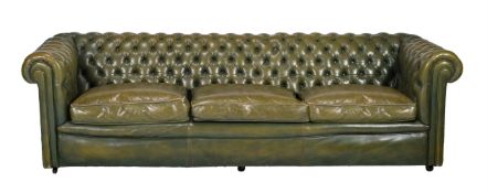 A LEATHER UPHOLSTERED SOFA IN VICTORIAN TASTE