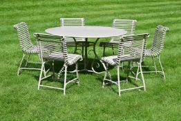 A SET OF GARDEN FURNITURE COMPRISING A CIRCULAR TABLE AND SIX CHAIRS