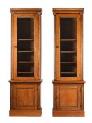 A PAIR OF VICTORIAN OAK AND PARCEL GILT BOOKCASES