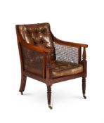 A GEORGE IV MAHOGANY LIBRARY ARMCHAIR IN THE MANNER OF GILLOWS