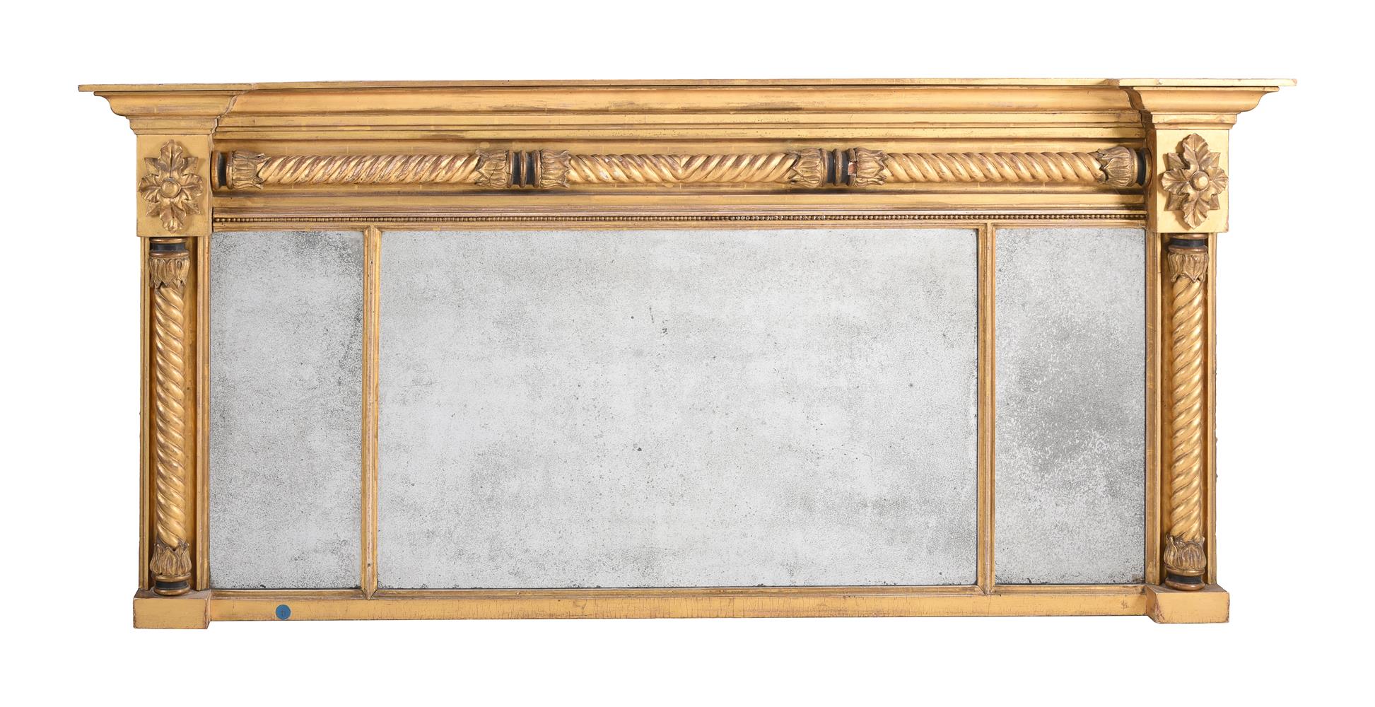 A GILTWOOD AND COMPOSITION OVERMANTEL WALL MIRROR