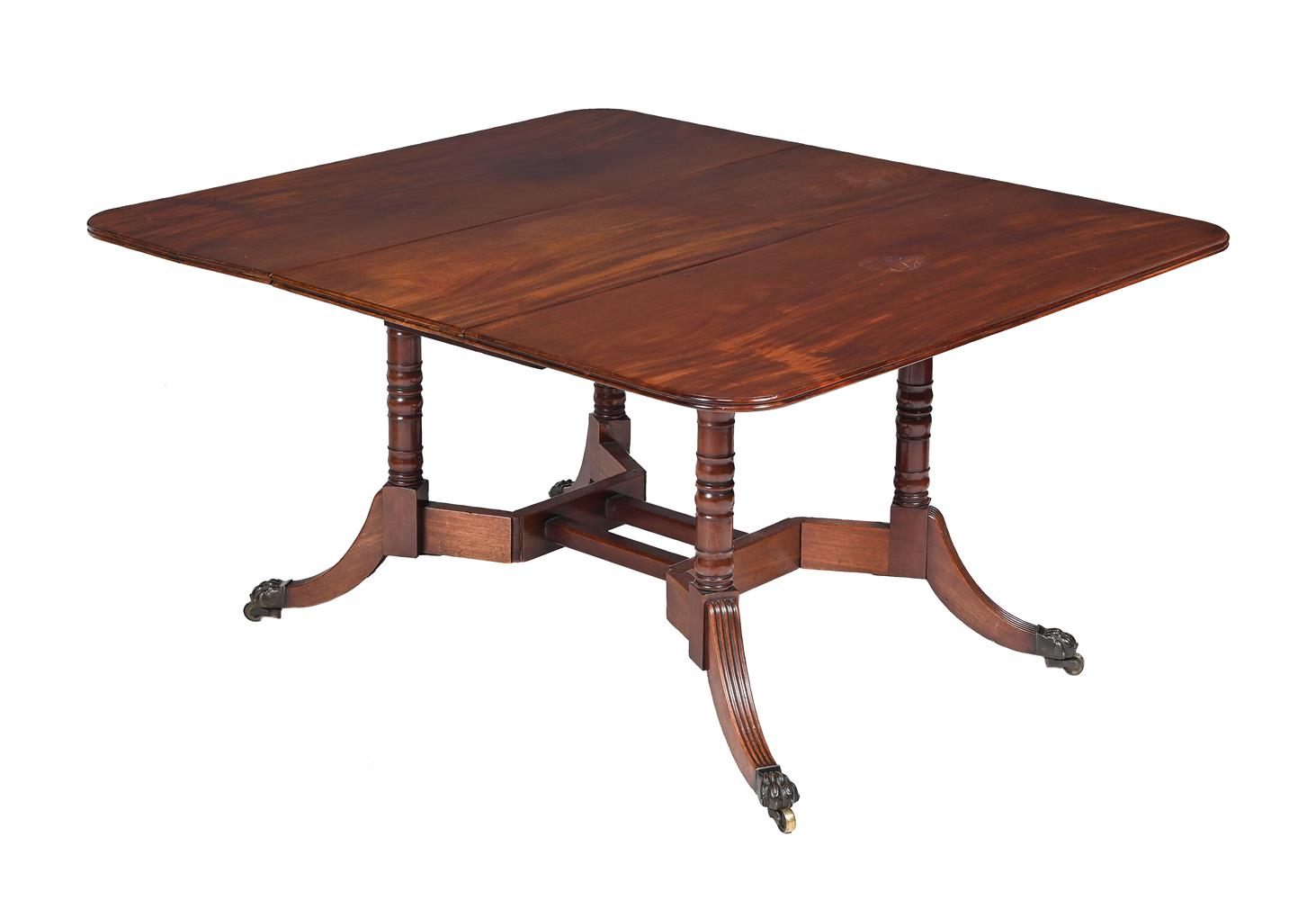 A GEORGE IV MAHOGANY DROP LEAF DINING TABLE