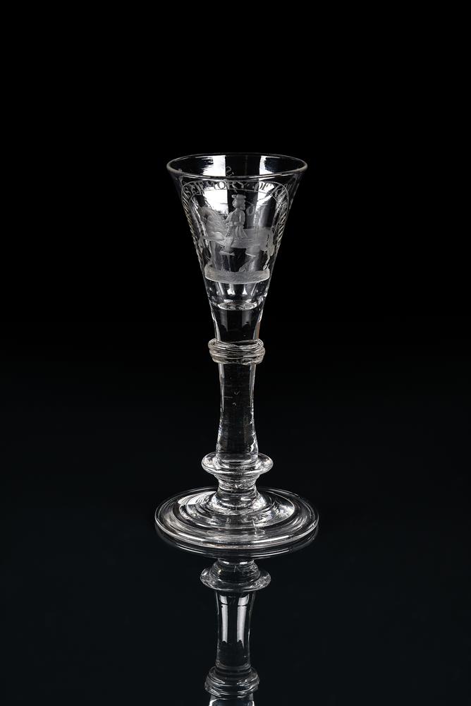 AN ENGRAVED WILLIAMITE WINE GLASS OF THE TYPE FROM THE PUGH BROTHERS STUDIOS