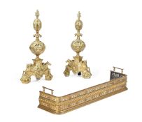 A PAIR OF GILT METAL ANDIRONS OF PIERCED BALUSTER FORM