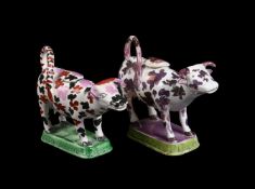 TWO SIMILAR BRITISH PEARLWARE MODELS OF COW CREAMERS