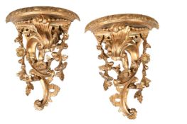 A PAIR OF CARVED GILTWOOD WALL BRACKETS, IN GEORGE II STYLE