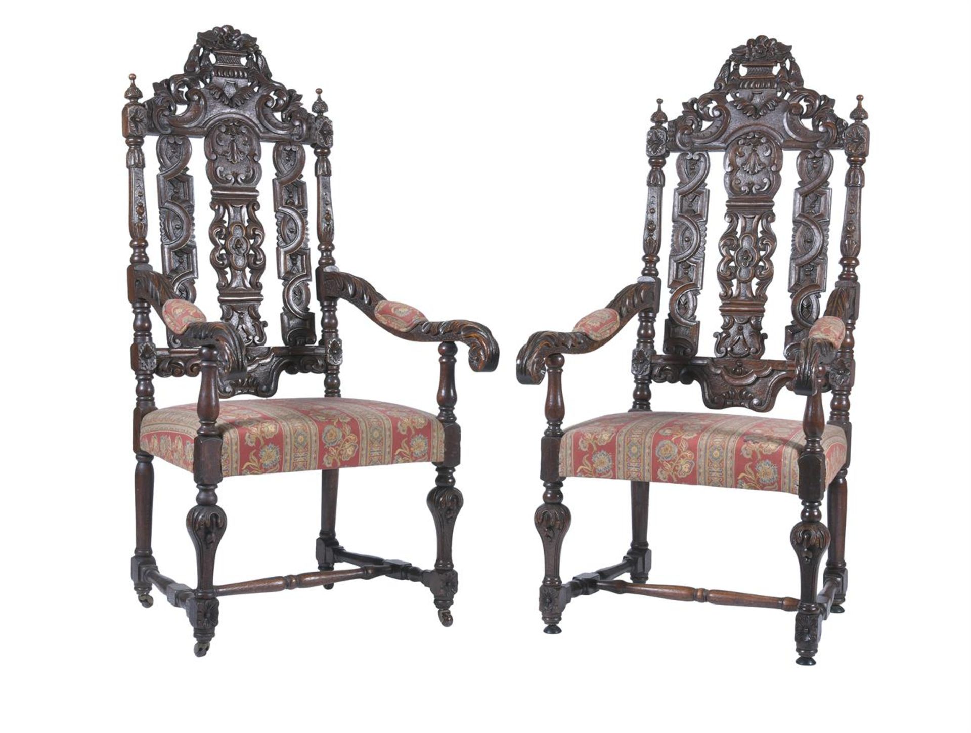 A PAIR OF CARVED OAK OPEN ARMCHAIRS