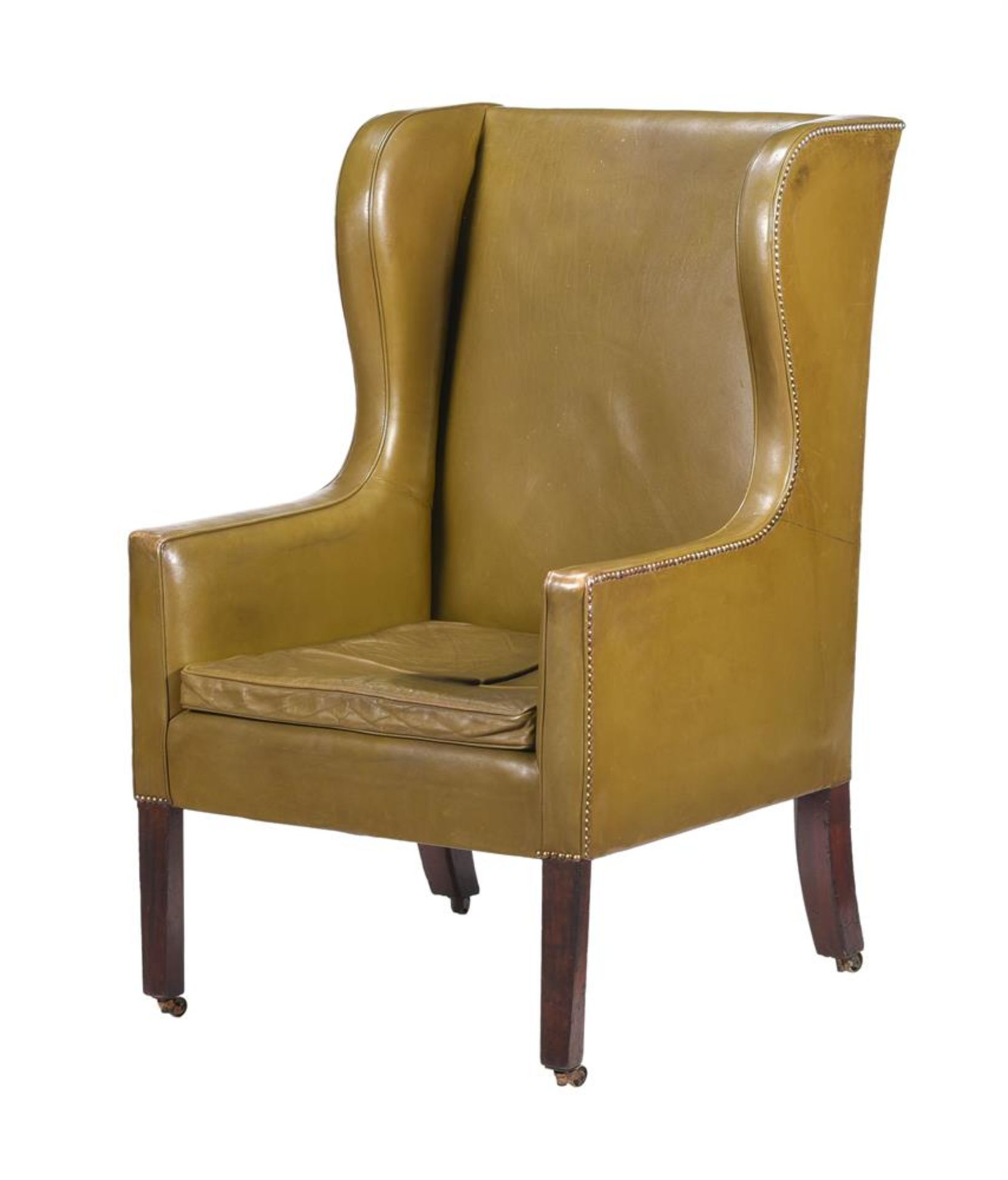 A LATE GEORGE III MAHOGANY AND LEATHER UPHOLSTERED WING ARMCHAIR